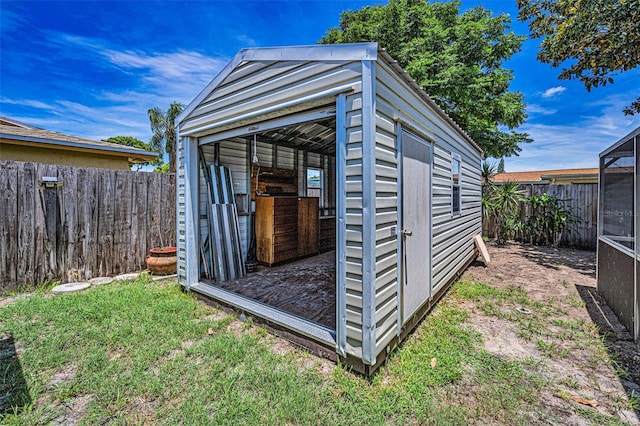 6053 11th Ave, New Port Richey, FL 34653 - view of shed featuring a fenced backyard