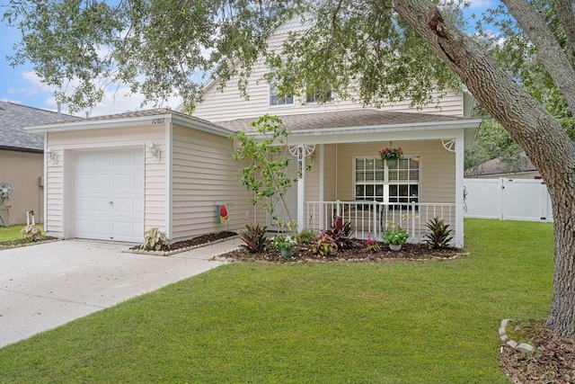 10807 Shasta Ct, Riverview, FL 33569 - view of front of house featuring covered porch, driveway, a garage, and a shingled roof