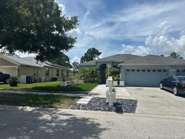 10920 Sailbrooke Dr, Riverview, FL 33579 - ranch-style house featuring concrete driveway, a garage, and stucco siding