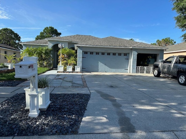10920 Sailbrooke Dr, Riverview, FL 33579 - ranch-style home with an attached garage, driveway, and stucco siding