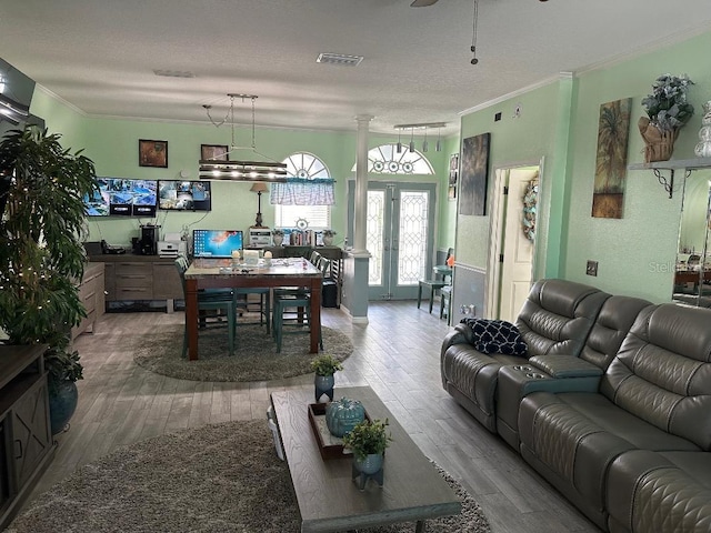 10920 Sailbrooke Dr, Riverview, FL 33579 - living room featuring a desk, crown molding, wood finished floors, a textured ceiling, and a ceiling fan