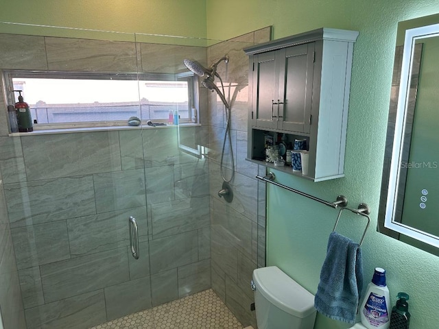 10920 Sailbrooke Dr, Riverview, FL 33579 - bathroom featuring a textured wall and a shower stall