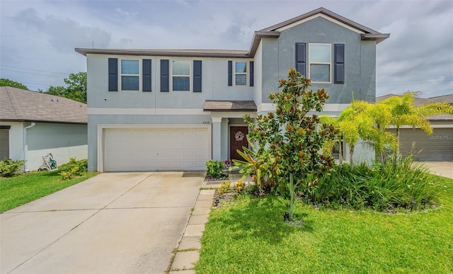 4954 Wild Senna Blvd, Tampa, FL 33619 - view of front of house with stucco siding, driveway, a garage, and a front yard