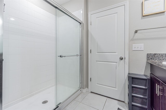 4954 Wild Senna Blvd, Tampa, FL 33619 - full bathroom with a shower stall, tile patterned floors, and vanity
