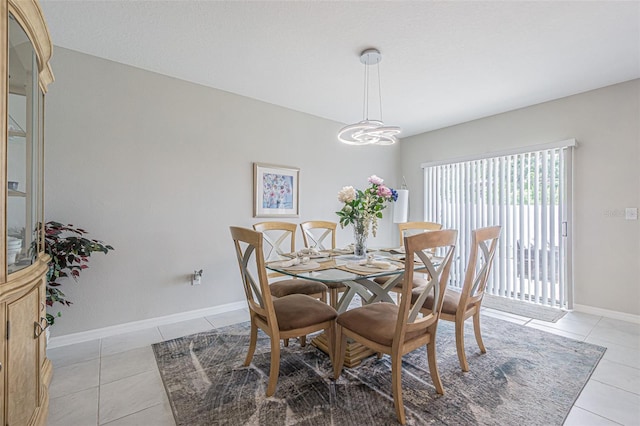 4954 Wild Senna Blvd, Tampa, FL 33619 - dining area featuring light tile patterned floors and a chandelier