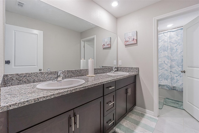 4954 Wild Senna Blvd, Tampa, FL 33619 - bathroom with double vanity and tile patterned flooring