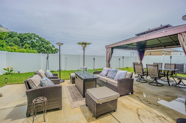 4954 Wild Senna Blvd, Tampa, FL 33619 - fenced backyard featuring an outdoor living space, a gazebo, outdoor dining space, and a patio