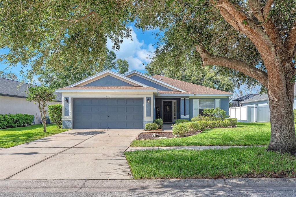 11841 Autumn Creek Dr, Riverview, FL 33569 - single story home featuring a garage, concrete driveway, and stucco siding
