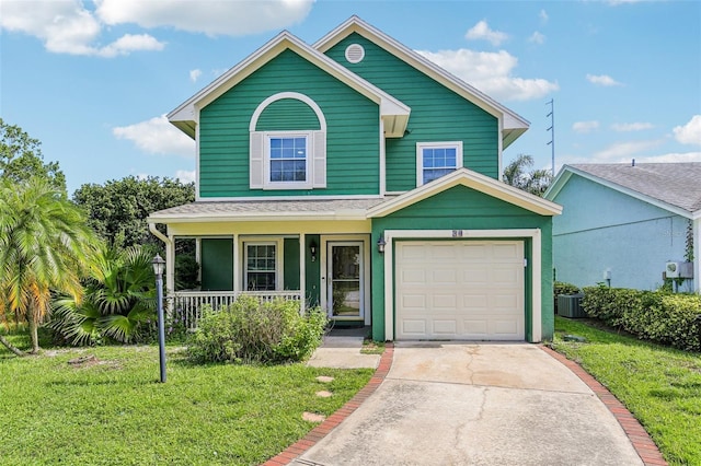 808 Franklin Cir, Palm Harbor, FL 34683 - view of front of home featuring a porch, a front lawn, driveway, a garage, and roof with shingles