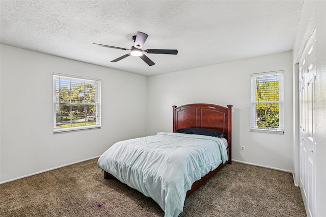 808 Franklin Cir, Palm Harbor, FL 34683 - bedroom with carpet, ceiling fan, and a textured ceiling