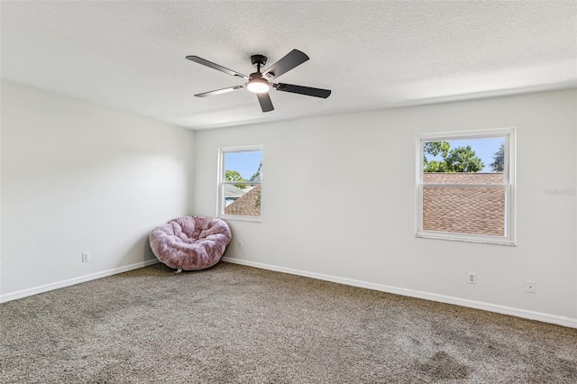 808 Franklin Cir, Palm Harbor, FL 34683 - unfurnished room featuring ceiling fan, healthy amount of natural light, carpet flooring, and a textured ceiling