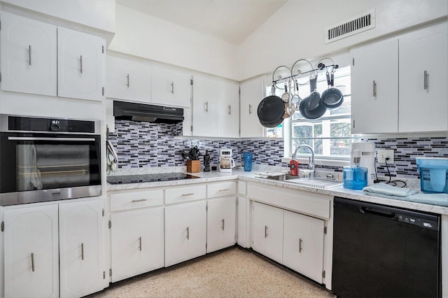 11830 86th Ave, Seminole, FL 33772 - kitchen with black appliances, under cabinet range hood, decorative backsplash, white cabinets, and light countertops