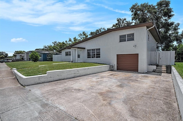 11830 86th Ave, Seminole, FL 33772 - view of front of property featuring concrete driveway, an attached garage, and brick siding