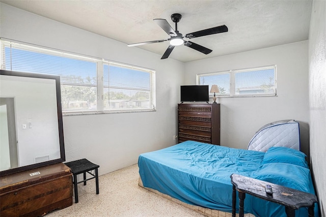 11830 86th Ave, Seminole, FL 33772 - bedroom featuring speckle patterned floor and ceiling fan