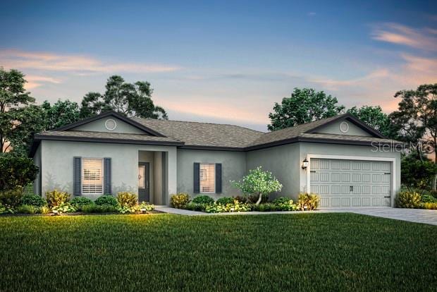 357 Bream Cir, Poinciana, FL 34759 - ranch-style house featuring a front yard, concrete driveway, a garage, and stucco siding
