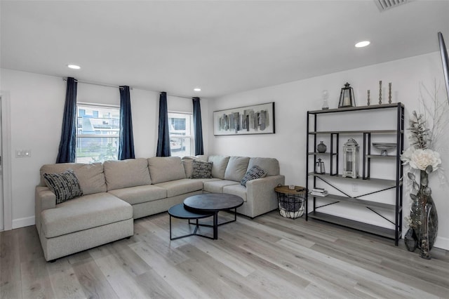 2630 St Josephs Dr W, Dunedin, FL 34698 - living room with light wood-style floors and recessed lighting