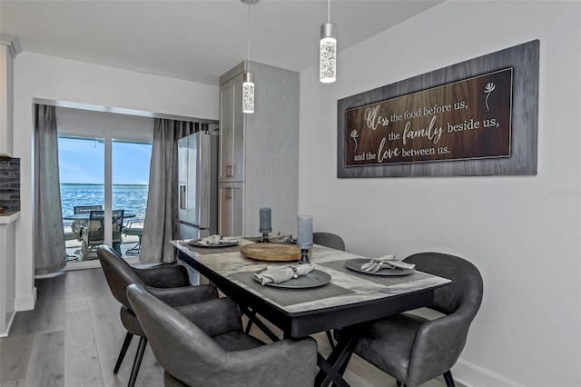 2630 St Josephs Dr W, Dunedin, FL 34698 - dining space with wood finished floors and baseboards