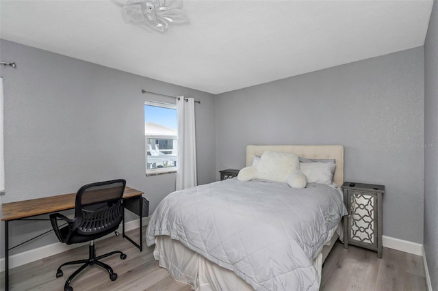 2630 St Josephs Dr W, Dunedin, FL 34698 - bedroom with wood finished floors and a desk