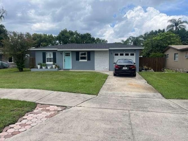 4487 Anderson Rd, Orlando, FL 32812 - ranch-style house with an attached garage and concrete driveway