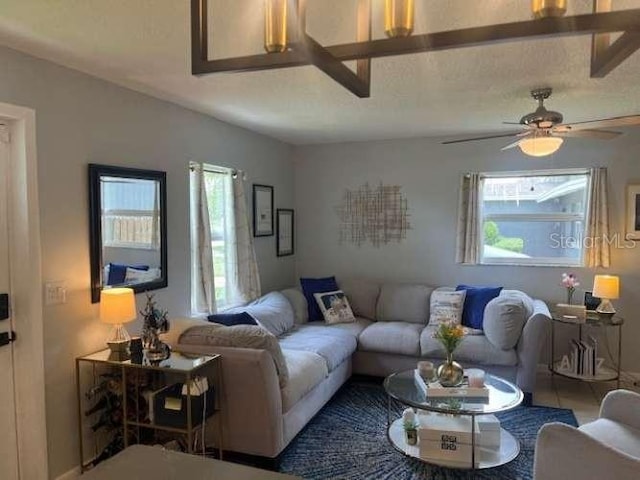 4487 Anderson Rd, Orlando, FL 32812 - living area with plenty of natural light and a ceiling fan