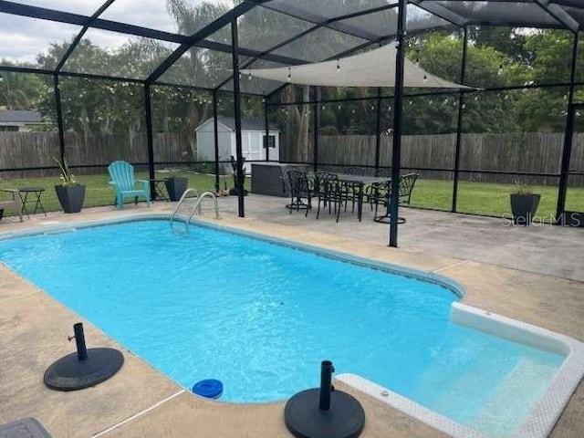 4487 Anderson Rd, Orlando, FL 32812 - view of swimming pool featuring a patio, a shed, a fenced backyard, and glass enclosure