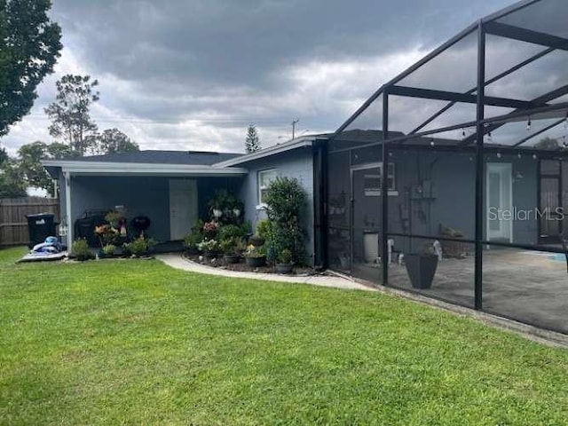 4487 Anderson Rd, Orlando, FL 32812 - back of house with a patio area and glass enclosure