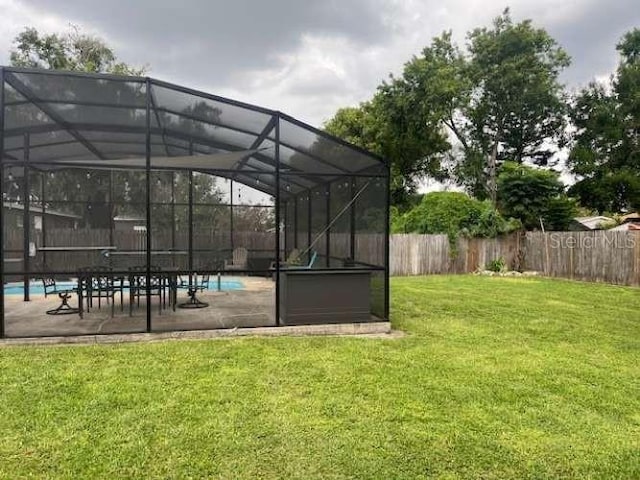 4487 Anderson Rd, Orlando, FL 32812 - fenced backyard featuring a patio and a lanai