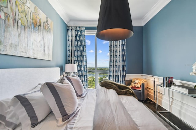 450 Knights Run Ave Unit 2004, Tampa, FL 33602 - bedroom with crown molding, a wall of windows, wood finished floors, wainscoting, and a water view