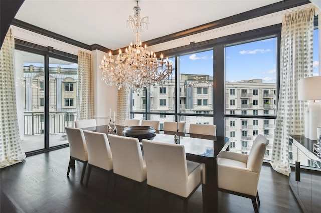 450 Knights Run Ave Unit 2004, Tampa, FL 33602 - dining room featuring a chandelier, wood finished floors, and crown molding