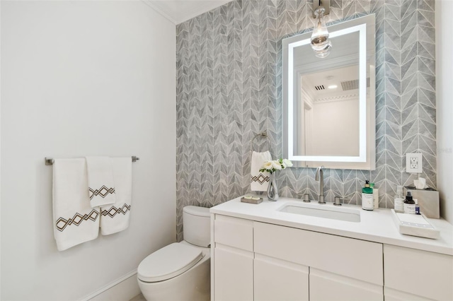 450 Knights Run Ave Unit 2004, Tampa, FL 33602 - bathroom featuring vanity, ornamental molding, and tile walls