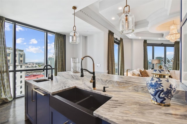 450 Knights Run Ave Unit 2004, Tampa, FL 33602 - kitchen with open floor plan, light stone countertops, hanging light fixtures, dark wood-style floors, and recessed lighting