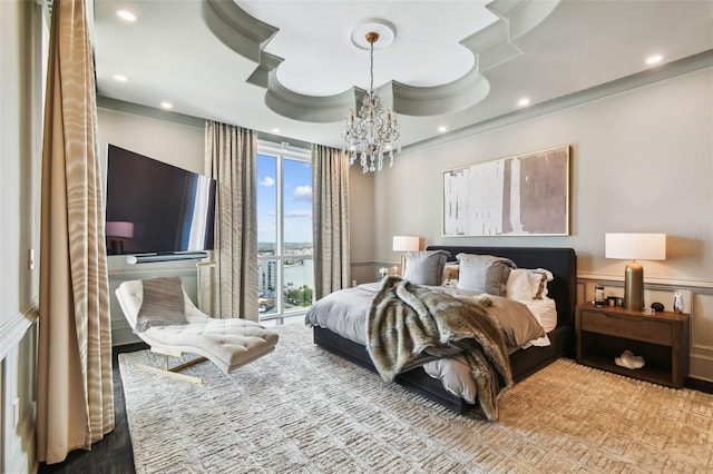 450 Knights Run Ave Unit 2004, Tampa, FL 33602 - bedroom with a chandelier, ornamental molding, a wainscoted wall, recessed lighting, and a decorative wall