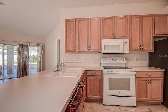 29417 Caddyshack Ln, San Antonio, FL 33576 - kitchen with white appliances, light tile patterned floors, light countertops, vaulted ceiling, and brown cabinets