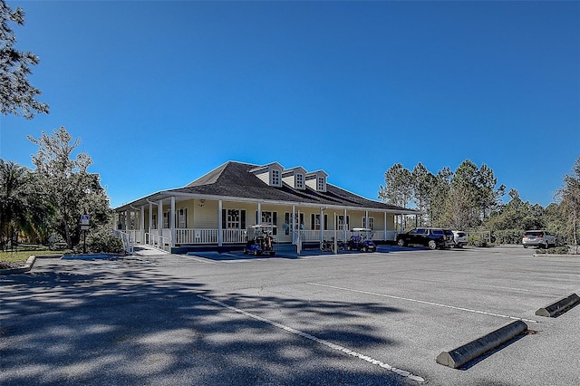 29417 Caddyshack Ln, San Antonio, FL 33576 - back of property with a porch and uncovered parking