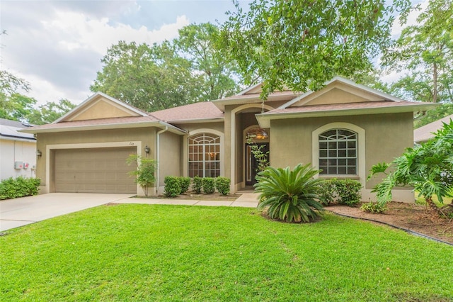 228 Taylor Bay Ln, Brandon, FL 33510 - ranch-style house featuring stucco siding, a front lawn, an attached garage, and driveway