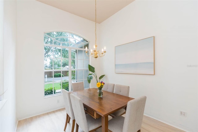 228 Taylor Bay Ln, Brandon, FL 33510 - dining space with a chandelier and light wood-style flooring