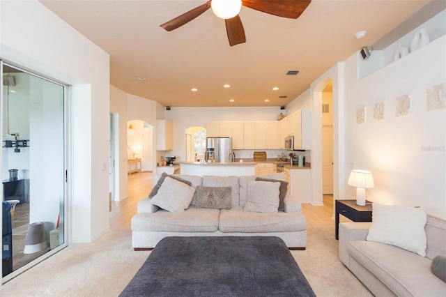 228 Taylor Bay Ln, Brandon, FL 33510 - living room featuring arched walkways, a ceiling fan, and recessed lighting