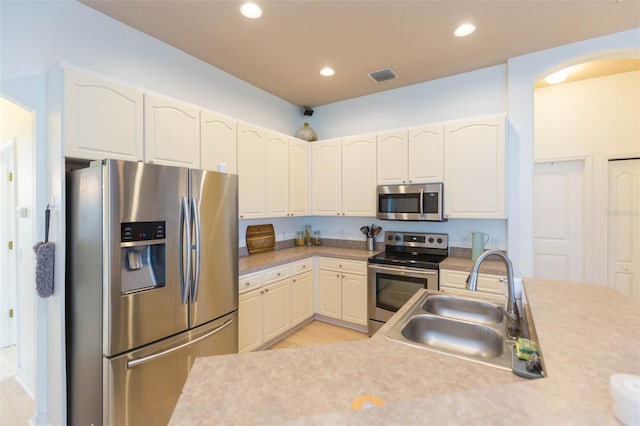 228 Taylor Bay Ln, Brandon, FL 33510 - kitchen with appliances with stainless steel finishes, light wood-style flooring, light countertops, and recessed lighting