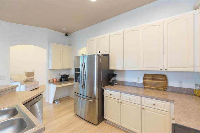 228 Taylor Bay Ln, Brandon, FL 33510 - kitchen featuring stainless steel appliances, light wood finished floors, light countertops, recessed lighting, and white cabinetry