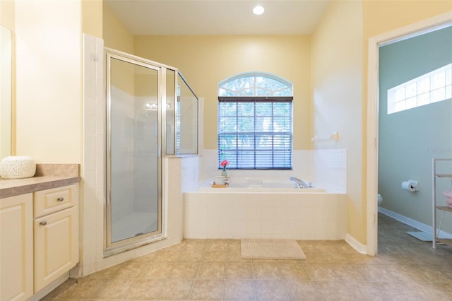228 Taylor Bay Ln, Brandon, FL 33510 - full bathroom with a garden tub, a shower stall, tile patterned floors, vanity, and recessed lighting