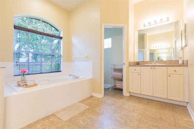 228 Taylor Bay Ln, Brandon, FL 33510 - bathroom with vanity, a garden tub, and tile patterned flooring