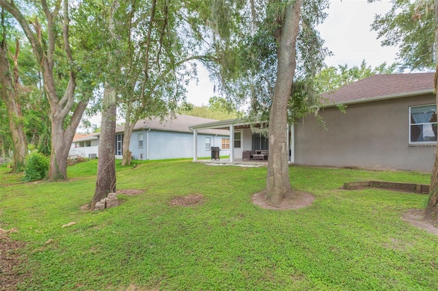 228 Taylor Bay Ln, Brandon, FL 33510 - view of green lawn with a patio area