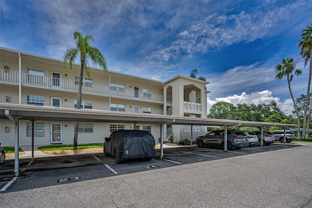 970 Virginia St Unit 109, Dunedin, FL 34698 - view of building exterior featuring covered parking