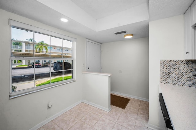 970 Virginia St Unit 109, Dunedin, FL 34698 - laundry room featuring light tile patterned flooring and recessed lighting