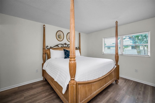 970 Virginia St Unit 109, Dunedin, FL 34698 - bedroom with wood finished floors and a textured ceiling