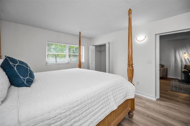 970 Virginia St Unit 109, Dunedin, FL 34698 - bedroom featuring wood finished floors and a closet