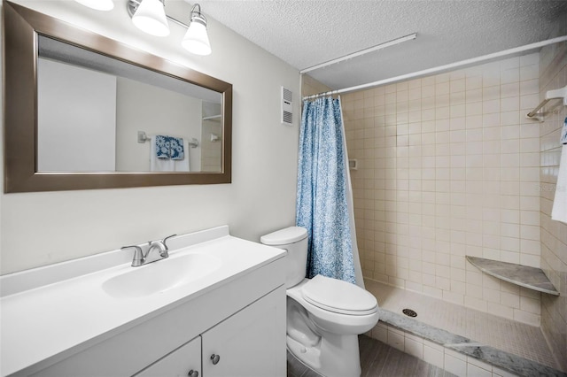 970 Virginia St Unit 109, Dunedin, FL 34698 - bathroom featuring a textured ceiling, vanity, and tiled shower