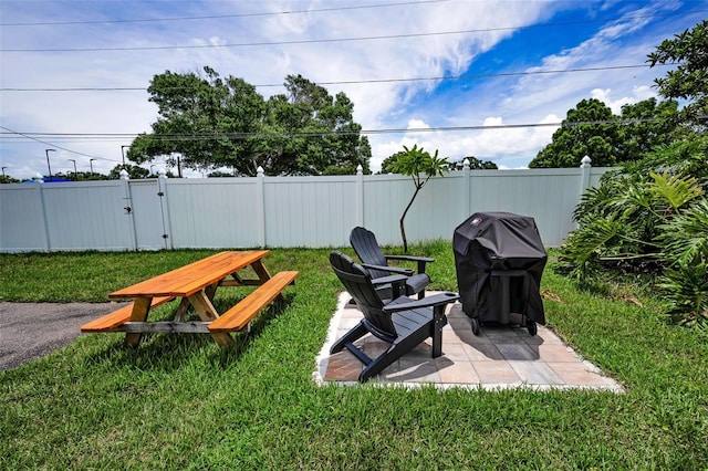 970 Virginia St Unit 109, Dunedin, FL 34698 - fenced backyard with a gate and a patio area