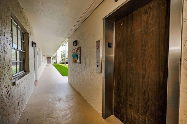 970 Virginia St Unit 109, Dunedin, FL 34698 - corridor featuring elevator