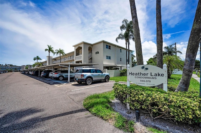 970 Virginia St Unit 109, Dunedin, FL 34698 - view of building exterior with covered and uncovered parking